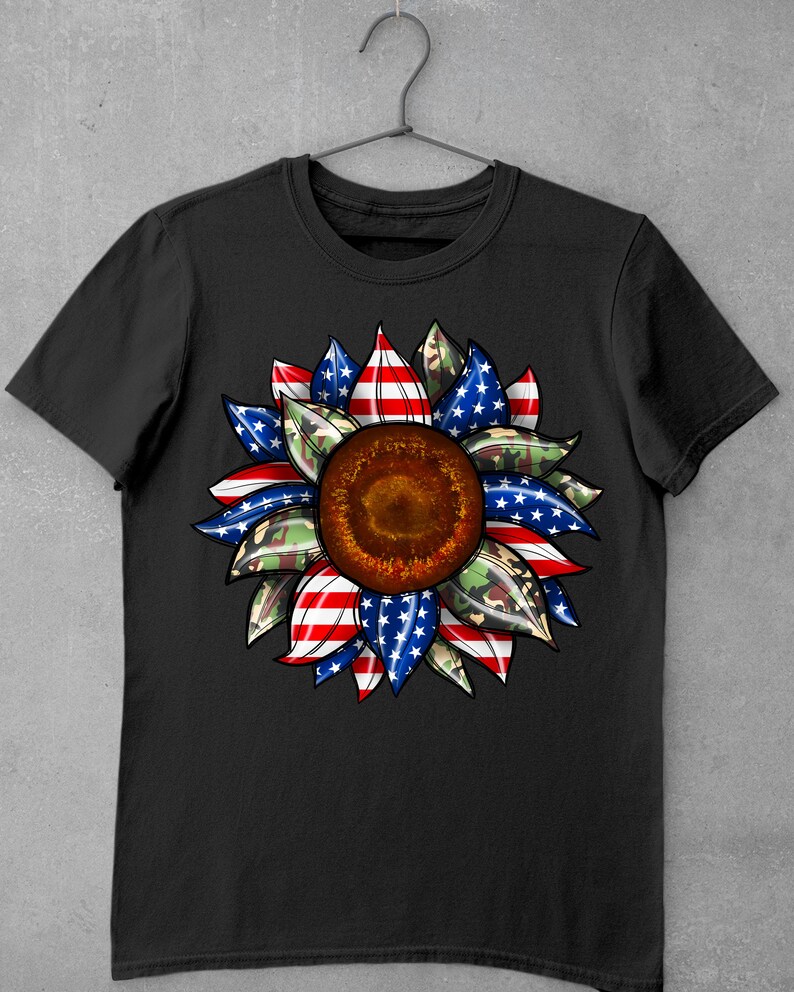 May include: Black t-shirt with a sunflower design. The sunflower is made up of red, white, and blue stripes, and green camouflage print.