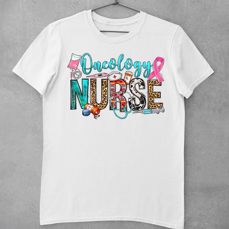 May include: White t-shirt with the text "Oncology Nurse" in colorful letters with medical symbols and a pink ribbon.