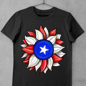 May include: Black t-shirt with a red, white, and blue sunflower design. The center of the sunflower is a blue circle with a white star.