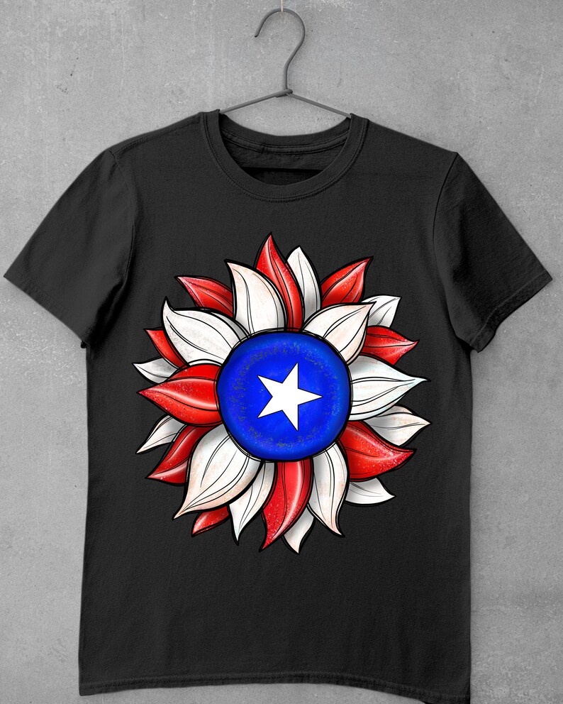 May include: Black t-shirt with a red, white, and blue sunflower design. The center of the sunflower is a blue circle with a white star.