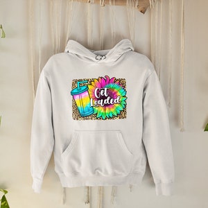 May include: White hoodie featuring a colourful tie-dye sunflower and a drink with a straw. The text "Get Loaded" is printed on the hoodie.