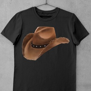 May include: A black t-shirt with a brown cowboy hat printed on the front.