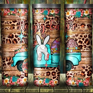 May include: A turquoise truck with a white bunny rabbit in the back, carrying Easter eggs. The truck is on a woodgrain background with a leopard print pattern. The text "Happy Easter" is written on the truck.