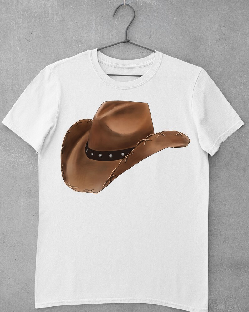 May include: White t-shirt with a brown cowboy hat graphic.
