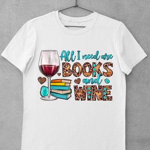 May include: White t-shirt with a graphic design of a glass of red wine, a stack of books, and the text "All I need are BOOKS and WINE".