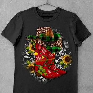 May include: Red cowboy boots with green and black plaid and leopard print accents, decorated with snowflakes, holly, and jingle bells. The boots are on a white and black cowhide background.