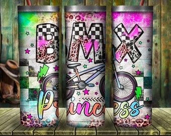 May include: A colorful tumbler with a BMX bike design. The tumbler features a white background with a checkered pattern, pink and blue stars, and the words "BMX princess".
