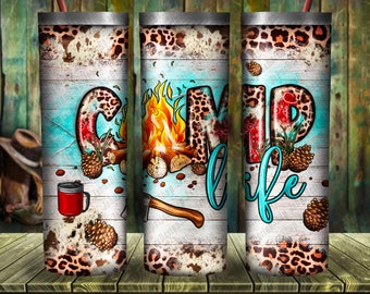 May include: A set of three stainless steel tumblers with a rustic wood background and a leopard print design. The tumblers feature the words "Camp Life" with a campfire, axe, and pine cones.