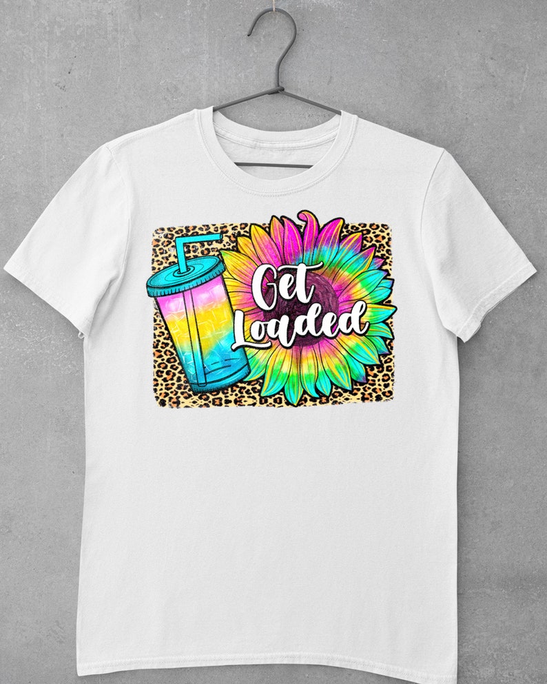 May include: White t-shirt featuring a graphic design of a tie-dye sunflower, a leopard print background, and a blue and yellow drink with the text "Get Loaded".