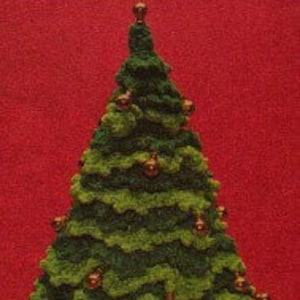 May include: A green knitted Christmas tree with a brown star on top and red baubles.