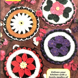 May include: Four handmade crochet hot pads with floral designs. The pads are in white, orange, red, purple, and green. Each pad has a unique flower pattern and a scalloped edge. The image text reads, "Enliven your kitchen with a lovely medley of blossom-covered hot pads."