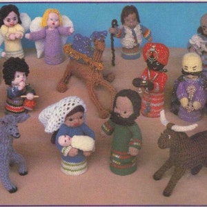 May include: A set of knitted nativity figures, including Mary, Joseph, baby Jesus, the three wise men, a camel, a donkey, and a sheep. The figures are all dressed in traditional clothing and are made with a variety of colors, including red, blue, green, and brown.