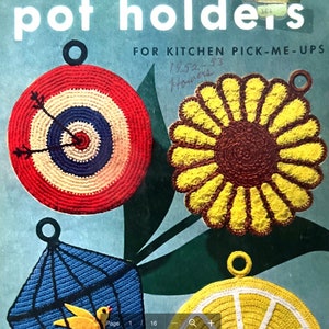 May include: A vintage book cover featuring four crocheted pot holders. The pot holders are shaped like a target, a sunflower, a birdcage, and a lemon. The book cover is titled "Pot Holders" and has the text "For Kitchen Pick-Me-Ups" printed on it.