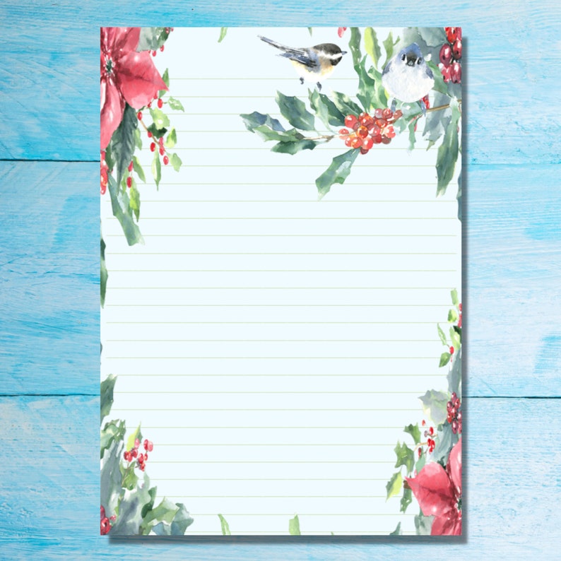 May include: A blue and white lined paper with a green, red, and white floral border. The border features holly, berries, and birds.
