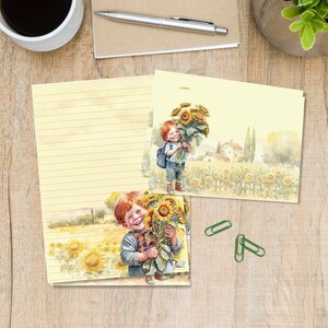 Op de afbeelding: Briefpapier set met een aquarel illustratie van een kind dat zonnebloemen in een veld vasthoudt. De set bevat gelijnd papier en notecards. Het kleurenpalet is zacht geel en groen, met een rustiek, landelijk thema.