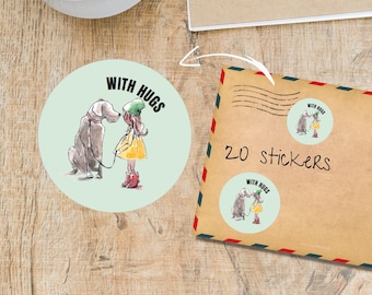 May include: Round stickers with a light green background featuring a watercolor illustration of a girl hugging a dog. The text "WITH HUGS" is above the illustration. An envelope with "20 stickers" is also visible.