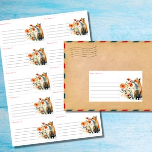 May include: Printable sheet of address labels featuring a watercolour illustration of a fox sniffing a red flower. The labels have the text "Please Deliver To" printed on them.