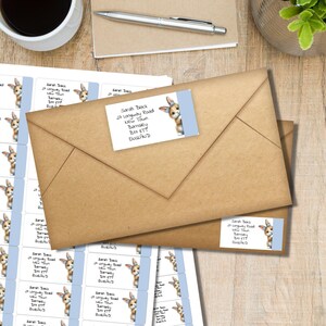 May include: Kraft paper envelopes with address labels featuring a cartoon bunny peeking from behind a light blue border. The labels include a name, address, and the word ENGLAND.