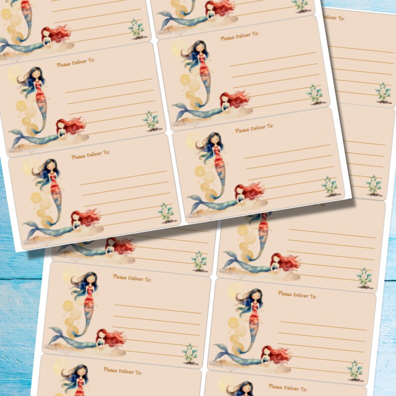 May include: Sheets of address labels featuring watercolor illustrations of mermaids. Each label has a beige background with a mermaid illustration and the text "Please Deliver To:" with lines for writing the address.