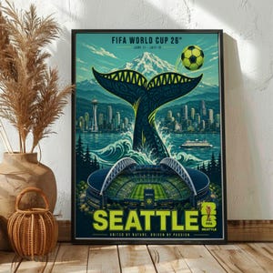 May include: A rectangular poster for the FIFA World Cup 26 in Seattle featuring a large whale tail rising from the water, the Seattle skyline with the Space Needle, a soccer stadium, a soccer ball, and the text FIFA WORLD CUP 26 SEATTLE.