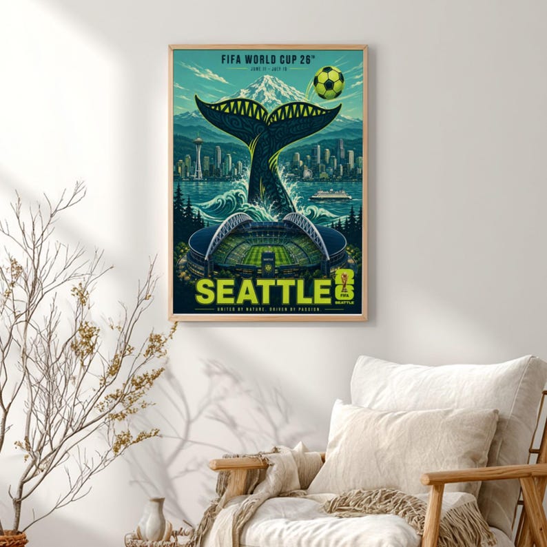 May include: A framed poster for the FIFA World Cup 26 in Seattle, featuring a large whale tail rising from the water, the Seattle skyline, a soccer stadium, a soccer ball, and Mount Rainier, with the text FIFA WORLD CUP 26 and SEATTLE.