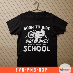 May include: Black t-shirt with white text that reads "Born to Ride Dirt Bikes Forced to Go to School". A silhouette of a person riding a dirt bike is above the text.