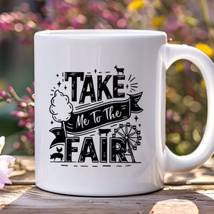 May include: White ceramic mug with a black design that says "Take Me To The Fair" with a cartoon cotton candy, pig, and Ferris wheel.