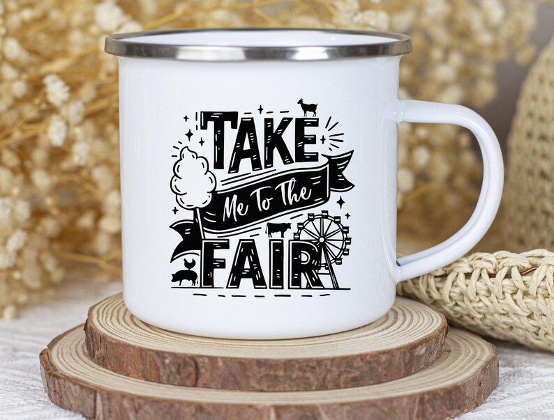 May include: White enamel mug with a black graphic that says "Take Me To The Fair" with a cartoon cotton candy, pig, and Ferris wheel.