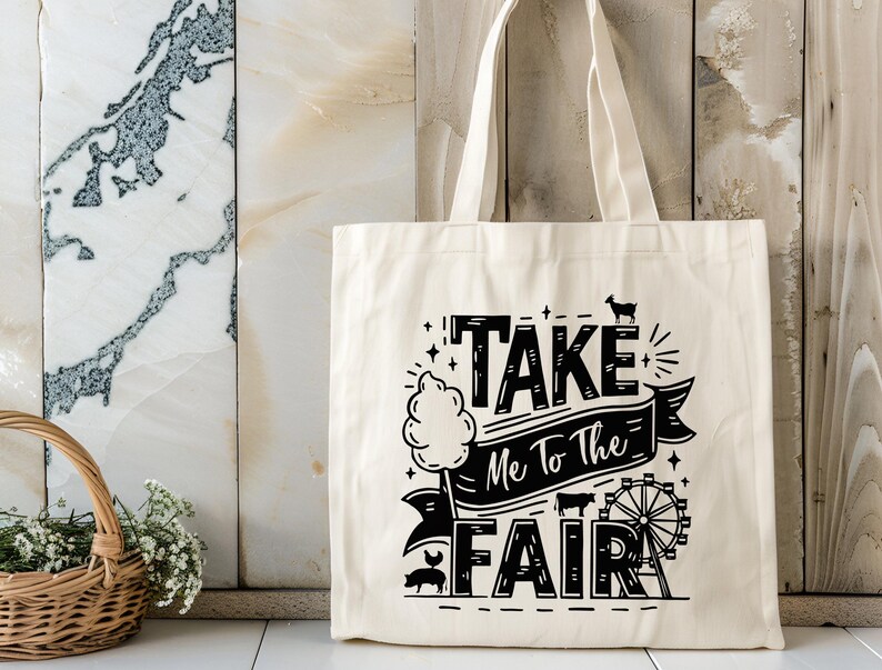 May include: A white canvas tote bag with black text that reads "Take Me To The Fair" with a graphic of a Ferris wheel, a pig, and a goat.