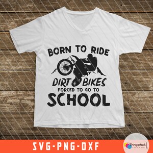 May include: A white t-shirt with a black graphic design that says "Born to Ride Dirt Bikes Forced to Go to School". The graphic includes a silhouette of a person riding a dirt bike.