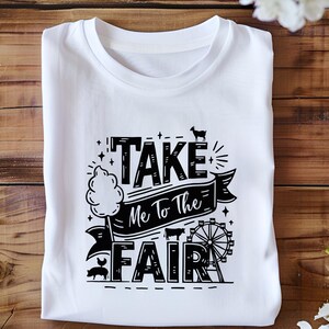 May include: White t-shirt with black text that reads "Take Me To The Fair" with a graphic of a cotton candy stand, a Ferris wheel, a pig, and a goat.