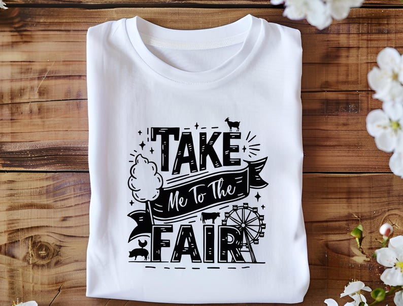 May include: White t-shirt with black text that reads "Take Me To The Fair" with a graphic of a cotton candy stand, a Ferris wheel, a pig, and a goat.
