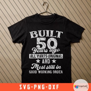 May include: Black t-shirt with white text that reads "BUILT 50 Years ago ALL PARTS ORIGINAL AND Most still in GOOD WORKING ORDER".