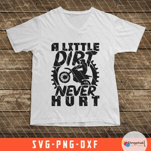 May include: A white t-shirt with a black graphic design that says "A Little Dirt Never Hurt" with a silhouette of a person riding a dirt bike.