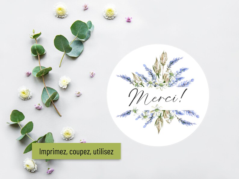 May include: A white circle with a watercolor illustration of lavender flowers and the word "Merci!" in black script. The circle is surrounded by white and pink flowers and green eucalyptus leaves on a white background.