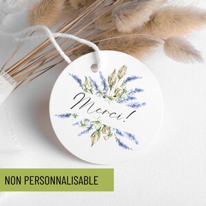 May include: Round white tag with a watercolor illustration of lavender flowers and the word "Merci!" in black script.