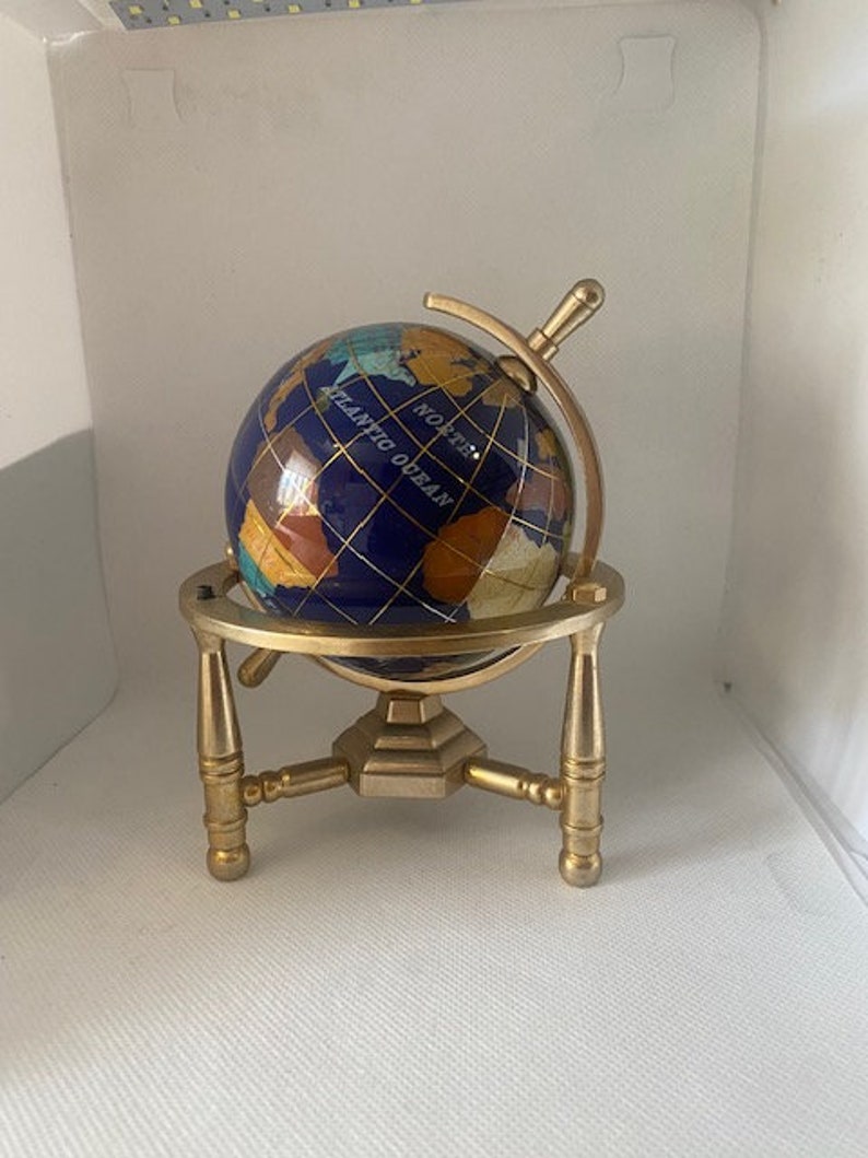 Hand made globe made of Lapis Lazuli and other semi precious stones with Gold Plated Brass tripod Stand 14 cm height and 8cm diameter. image 1