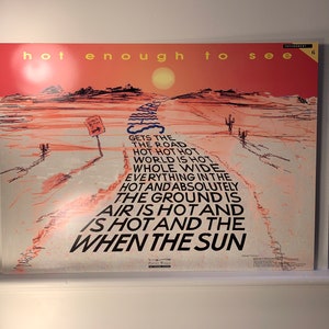 May include: Poster with a desert landscape illustration in shades of red and white, featuring a road leading to a sun. Text reads "hot enough to see" and a poem about heat. Includes a sign and cacti.