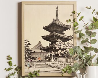 Puede incluir: Una impresión en blanco y negro de una pagoda japonesa con flores de cerezo en un marco de madera.