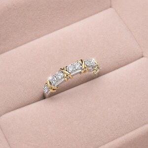 Shop our sixteen stone moissanite full eternity band. This unique two tone X cross wedding ring in gold vermeil features a brilliant criss cross design. The perfect stackable anniversary band, designer promise ring, or bridal jewelry for women.