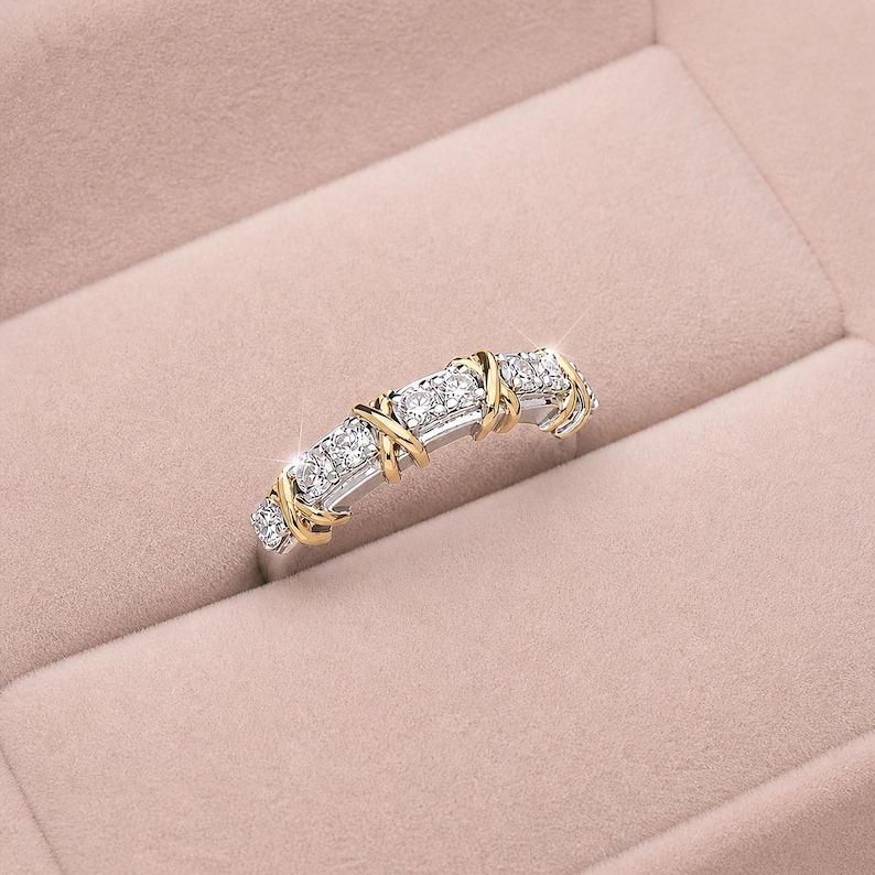 Shop our sixteen stone moissanite full eternity band. This unique two tone X cross wedding ring in gold vermeil features a brilliant criss cross design. The perfect stackable anniversary band, designer promise ring, or bridal jewelry for women.