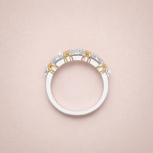 Shop our sixteen stone moissanite full eternity band. This unique two tone X cross wedding ring in gold vermeil features a brilliant criss cross design. The perfect stackable anniversary band, designer promise ring, or bridal jewelry for women.