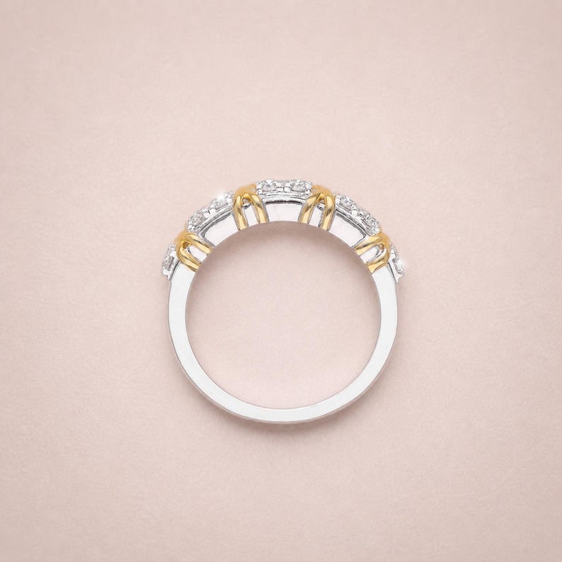 Shop our sixteen stone moissanite full eternity band. This unique two tone X cross wedding ring in gold vermeil features a brilliant criss cross design. The perfect stackable anniversary band, designer promise ring, or bridal jewelry for women.