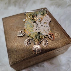 Boho chic fabric brooch pin in a vintage box.
