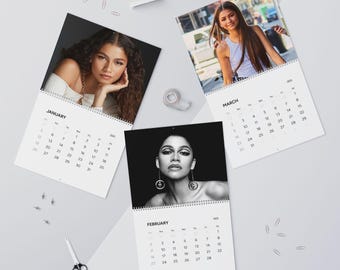 May include: A calendar featuring a different photo of a woman on each month. The months of January, February, and March are shown. The calendar is printed in black and white.