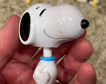 SNOOPY characters, Snoopy Figurines, Snoopy Collectibles, Charlie Brown Snoopy Comic Characters and boomerangs; Bobblehead Snoopy; Dr Dog