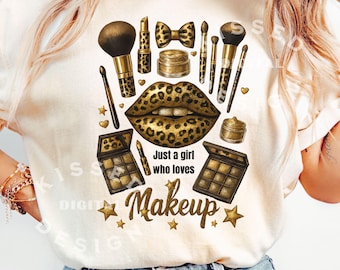 May include: A cream-colored t-shirt featuring a makeup-themed design. The design includes a pair of leopard-print lips, makeup brushes, lipstick, and eyeshadow palettes. The text "Just a girl who loves Makeup" is also included.