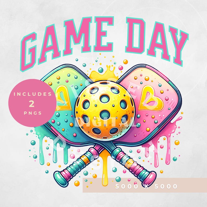 May include: A colorful illustration of two pickleball paddles crossed with a yellow pickleball in the center. The paddles are pink, blue, and green with a dripping paint effect. The text "GAME DAY" is above the paddles in pink and blue letters.