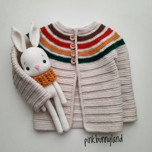 Handmade crochet baby cardigan. Handmade cardigan and cute rabbit