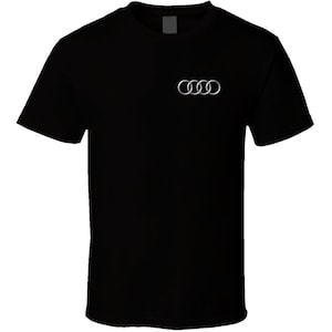 May include: A black t-shirt with the Audi logo in silver on the front.